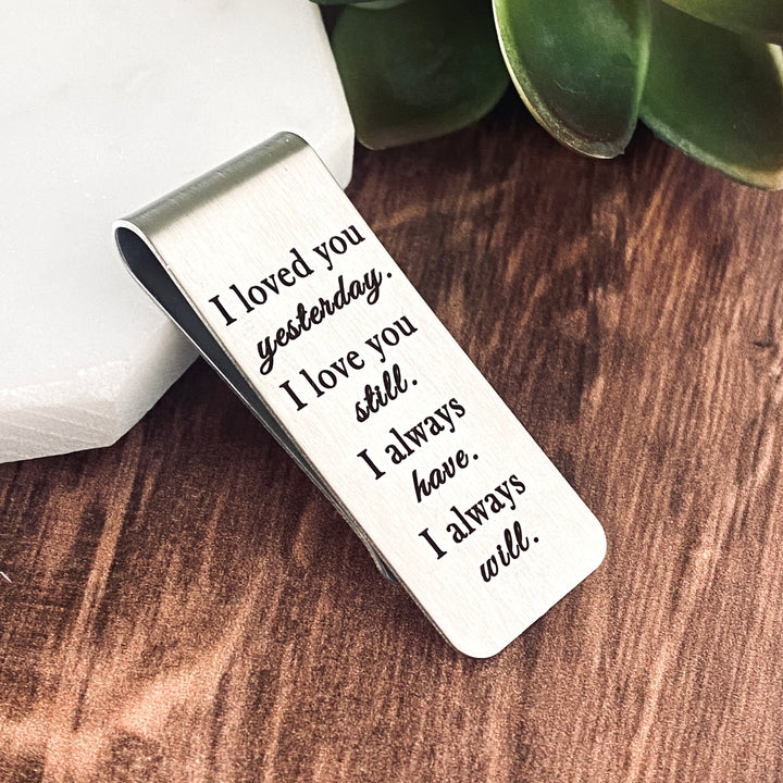 Silver stainless steel money clip engraved with the phrase, "I loved you yesterday, I love you still. I always have, I always will. Silver Money clip