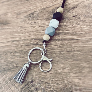 black, marble, grey silicone beaded lanyard with round key ring and lobster claw keychain and matching grey tassel.