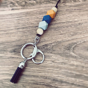 burn orange, blue, grey silicone beaded lanyard with round key ring and lobster claw keychain and matching blue tassel.