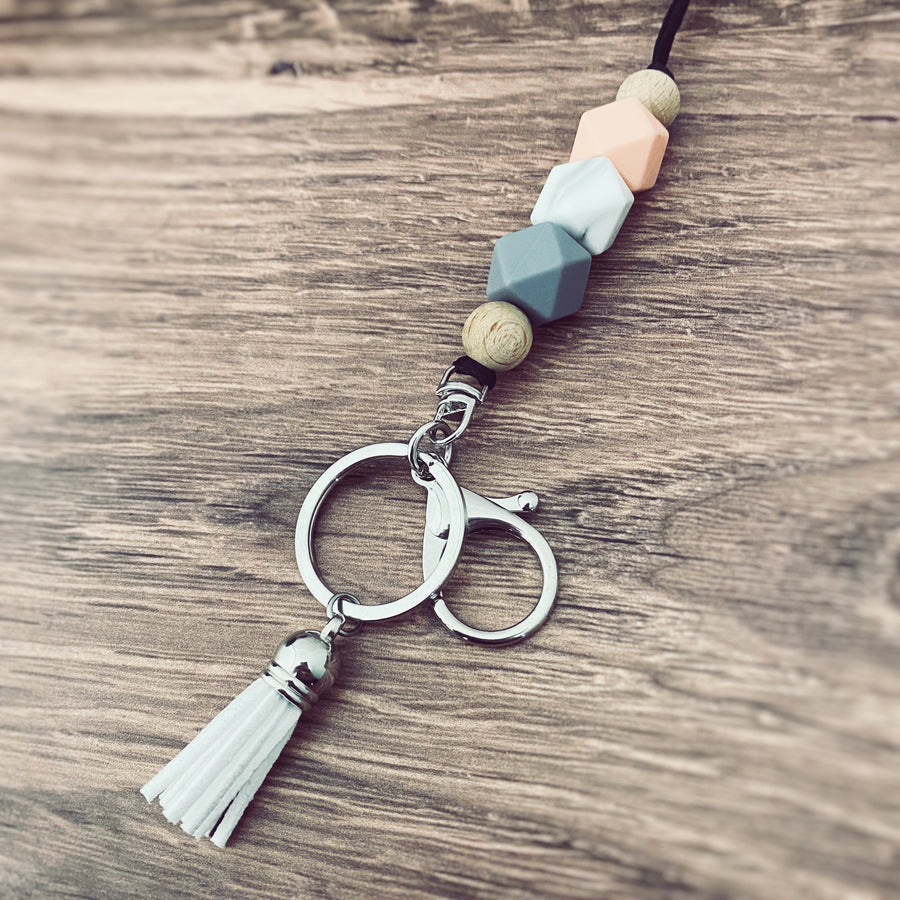 design 3 lanyard with a coral, marble, grey hexagon silicone beaded necklace 