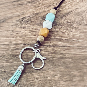 turquoise, marble, burnt orange silicone beaded lanyard with round key ring and lobster claw keychain and matching  tassel.