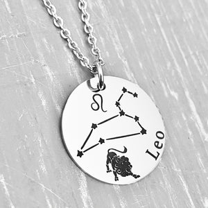 silver stainless steel 7/8" disc engraved with Leo, its constellation, symbol, and the Lion. attached to a stainless steel cable chain with lobster clasp