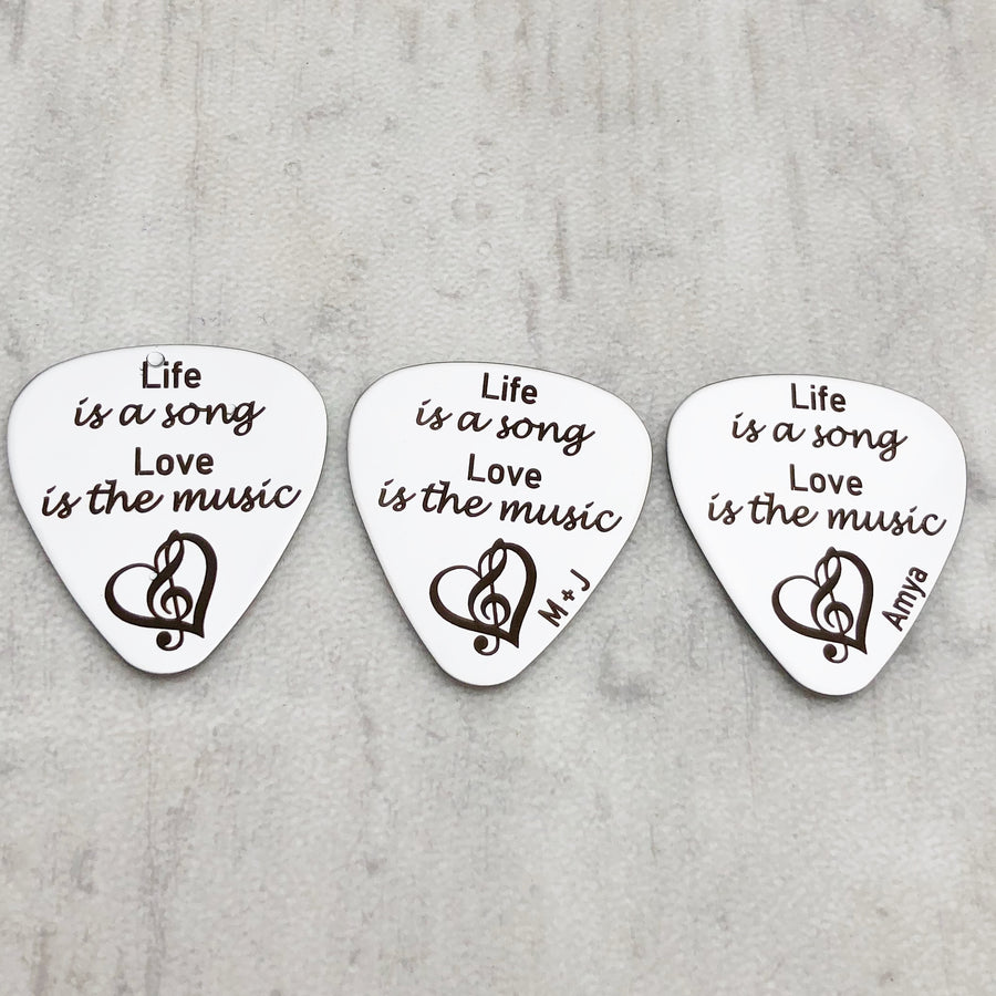 "Life is a song. Love is the music" silver stainless steel guitar pick personalized with initials, name , and date