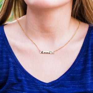 women wearing rose gold horizontal mama wolf bar necklace with 3 cubs