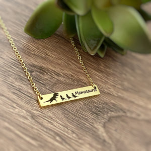 Yellow Gold Horizontal Bar necklace engraved with "Mamasaurus" and a Mom trex dino and 3 baby dinos
