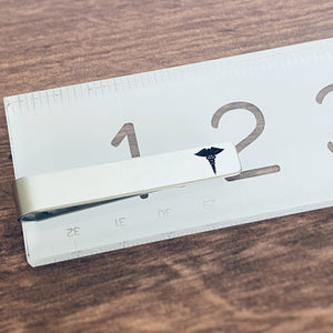 tie clip on ruler to show 2" length