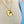 mother wearing the yellow gold mothers pendant necklace