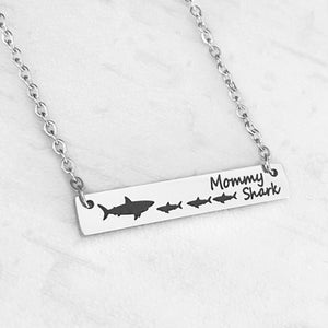 Silver mommy shark engraved bar necklace with 1 mom shark and 3 baby sharks