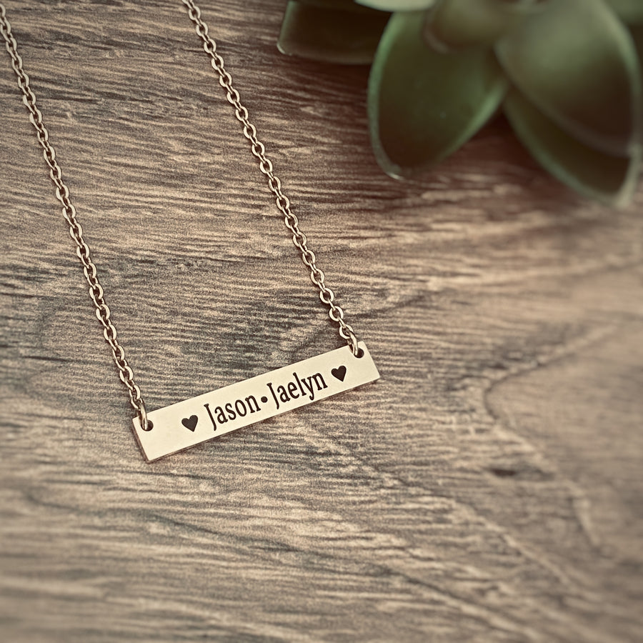 Rose Gold horizontal bar necklace engraved with the 2 children's names Jason and Jaelyn