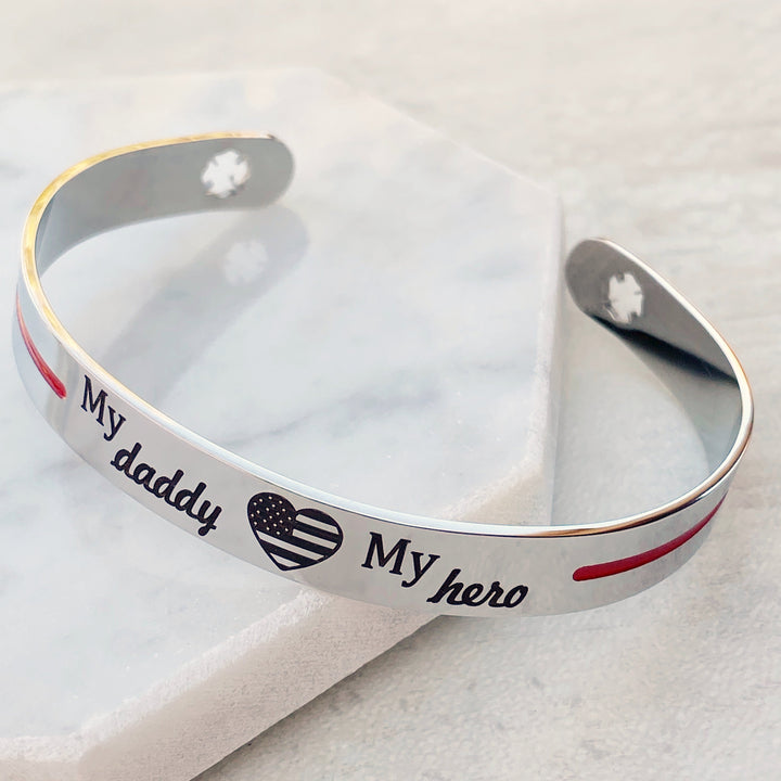 Silver stainless steel cuff bracelet thin red line with the engraving my daddy my hero with an american flag heart and maltese fireman cross cutout