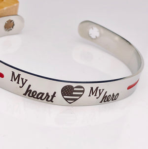 Silver stainless steel cuff bracelet thin red line with the engraving my heart my hero with an american flag heart and maltese fireman cross cutout