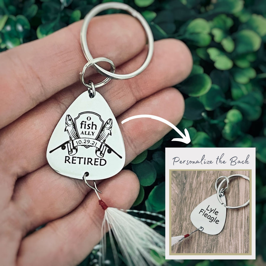 Women holding lure and showing the option the back can be engraved with a personal custom message.