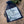 AA recovery keychain packaged in stamps of love organza gift bag.
