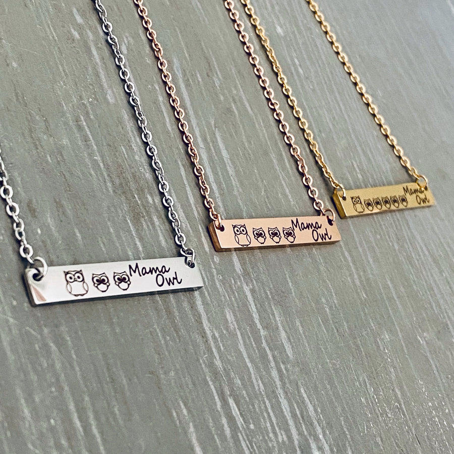 Mama Owl and 2 owlets engraved on a silver bar necklace. Mama Owl and 3 owlets engraved on a rose gold bar necklace. Mama Owl and 5 owlets engraved on a yellow gold bar necklace. 