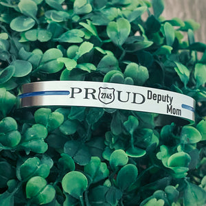 Silver thin blue line cuff bracelet engraved with police badge and number 2745 and phrase "Proud Deputy Mom"