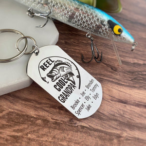 silver dog tag keychain engraved with a bass fish, fishing pole, and "Reel Cool Grandpa" along with children's names