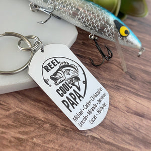 silver dog tag keychain engraved with a bass fish, fishing pole, and "Reel Cool Papa" along with children's names