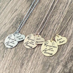 round pendant necklace engraved with "Remember I am with you Always" next to the round pendant is a heart engraved with "Love, Troy". Also necklace in rose gold with love norman, and necklace in yellow gold with a heart that says Love Papa. Each necklace is attached to a cable chain 