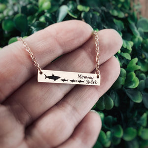 Rose Gold engraved mommy shark bar necklace with 1 mom shark and 3 baby sharks