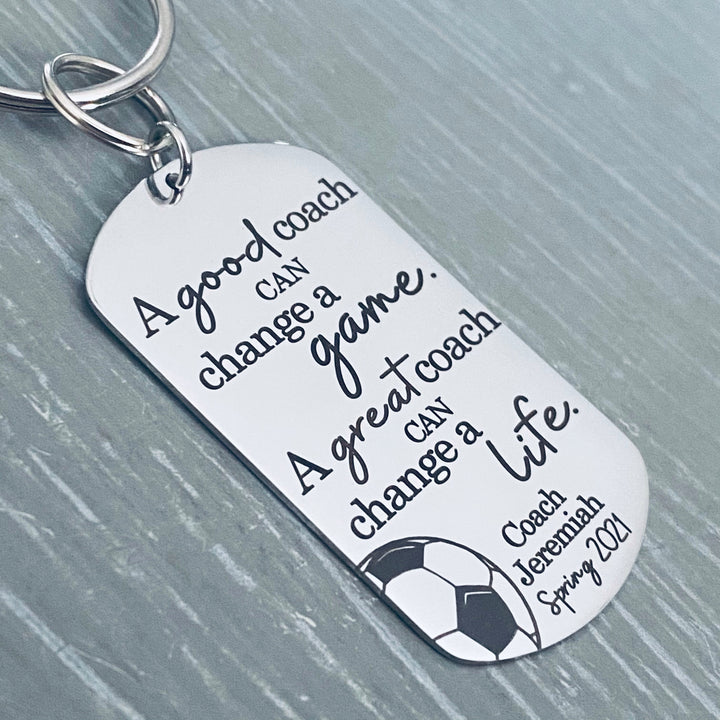 1 inch X 2 inch silver shiny stainless steel engraved dog tag keychain. Engraved with the phrase "A good coach can change a game. A great coach can change a life. Coach Jeremiah Spring 2021"