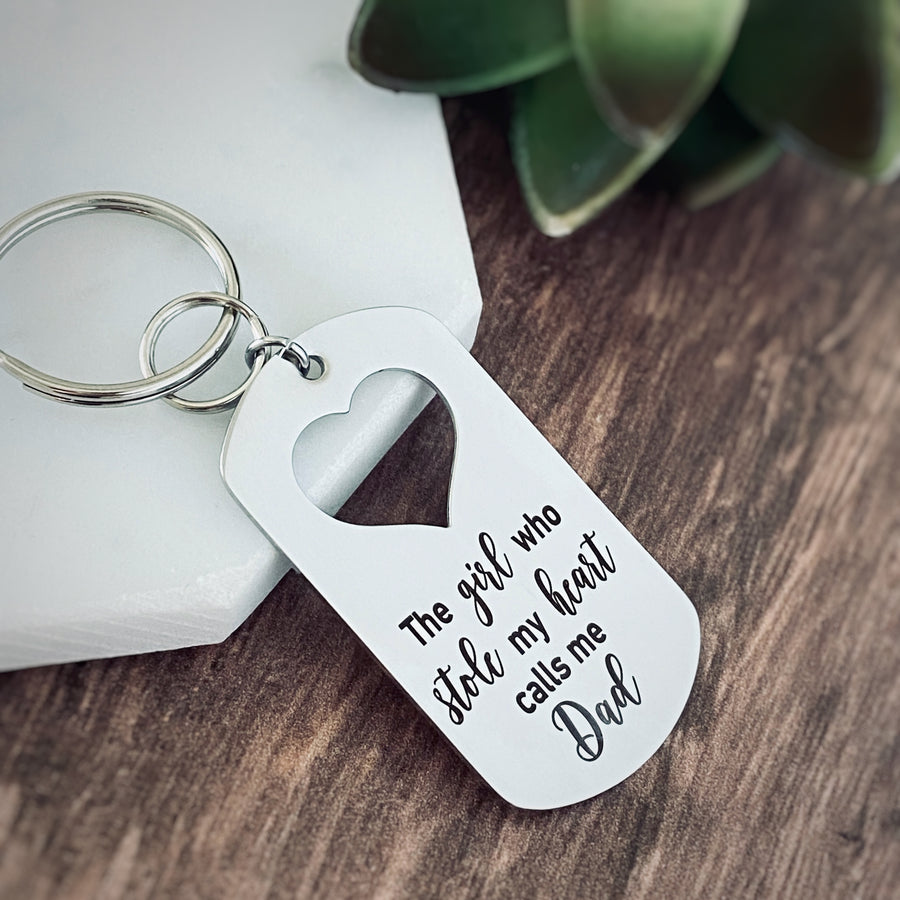 Silver Stainless Steel dog tag keychain engraved with "The girl who stole my heart calls me Dad".