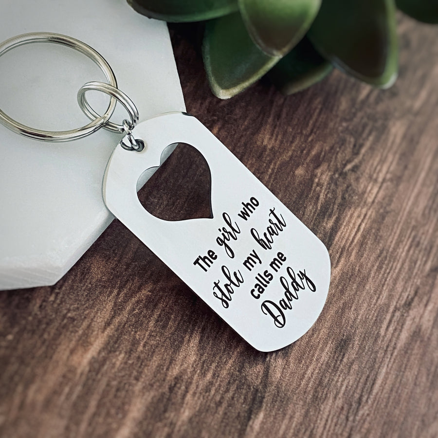 Silver Stainless Steel dog tag keychain engraved with "The girl who stole my heart calls me Daddy".