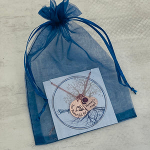 necklace in stamps of love blue organza gift bag