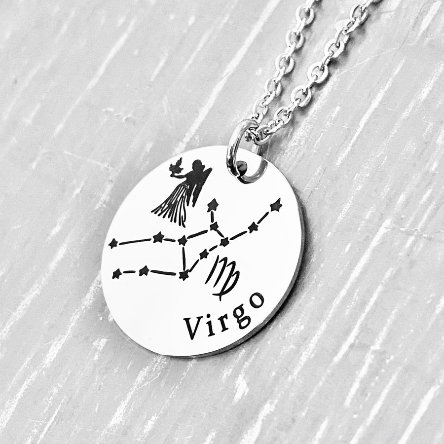 silver stainless steel 7/8" disc engraved with Virgo, its constellation, symbol, and the Maiden. attached to a stainless steel cable chain with lobster clasp