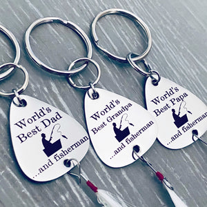 3 separate stainless steel fishing lures keychains. first engraved "World's Best Dad...and fisherman". next is "world's best grandpa...and fisherman" and lastly is the lure "world's best Papa...and fisherman". each lure is attached to a 1 inch stainless steel keyring and each has a fishing feather attached to the bottom of the lure