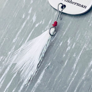 close up of feather attached to the bottom of the lure