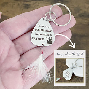 fishing lure on womans hand to show size and the option to personalize the back of the lure with your custom message. this image shows "Baby Flores May 2022"