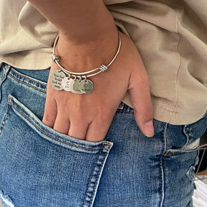 Woman wearing mom charm bracelet