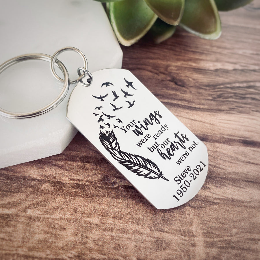 silver engraved memorial keychain with the phrase "Your wings were ready by mom heart was not." with the name "Steve" and the year of birth 1950 and the date of death 2021